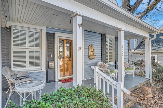 property entrance featuring covered porch