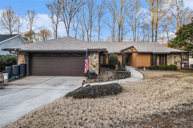 single story home with a garage and a front lawn