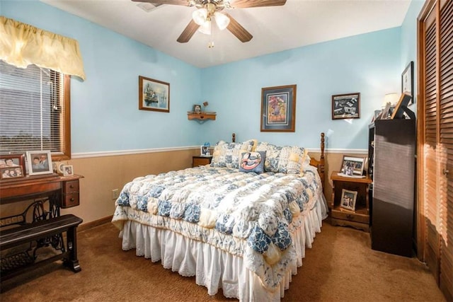 bedroom featuring ceiling fan, carpet flooring, and a closet