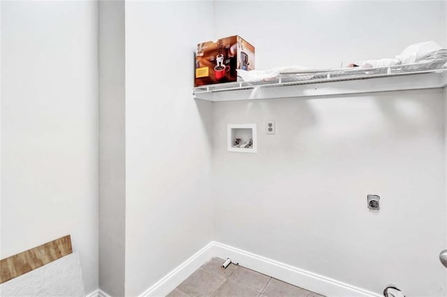 clothes washing area featuring light tile patterned floors, hookup for a washing machine, and hookup for an electric dryer