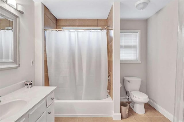 full bathroom with toilet, vanity, tile patterned floors, and shower / bath combination with curtain