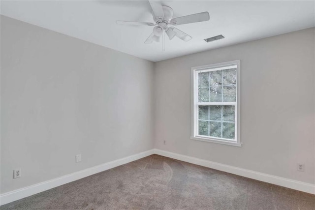 unfurnished room with carpet floors and ceiling fan