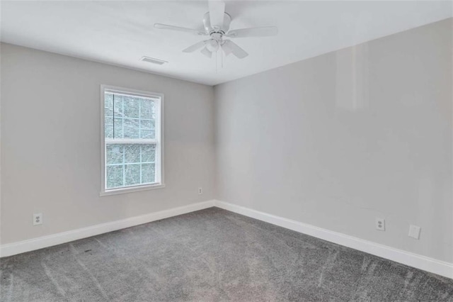 spare room featuring ceiling fan and carpet flooring