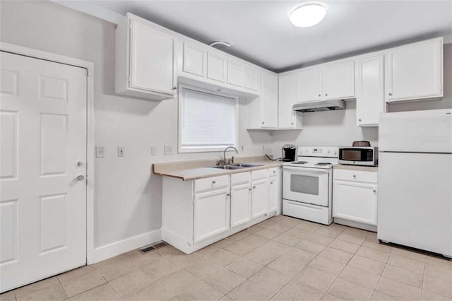 kitchen featuring light tile patterned floors, white cabinetry, sink, and white appliances