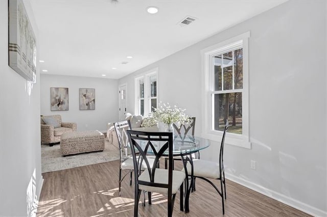 1766 Blossom Ln, Austell, GA 30168 - dining space with recessed lighting, baseboards, visible vents, and wood finished floors