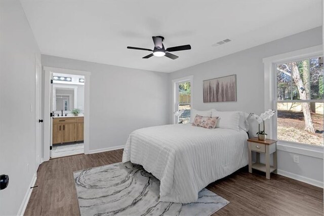 1766 Blossom Ln, Austell, GA 30168 - bedroom featuring baseboards, multiple windows, and wood finished floors