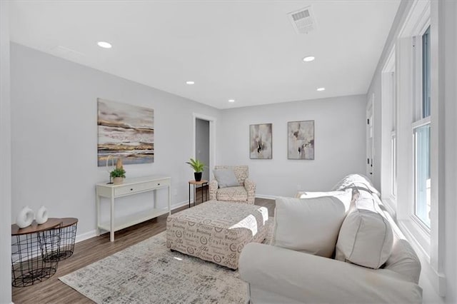 1766 Blossom Ln, Austell, GA 30168 - living area featuring baseboards, recessed lighting, wood finished floors, and visible vents