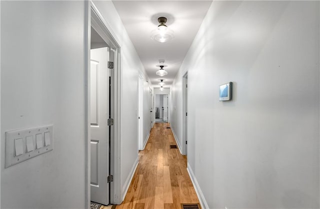 hallway featuring light wood-type flooring