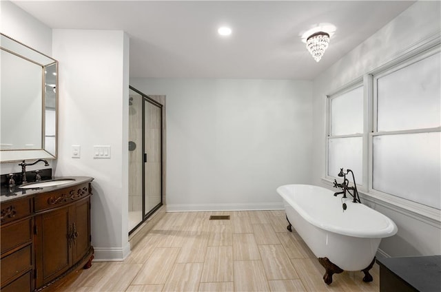 bathroom with independent shower and bath and vanity