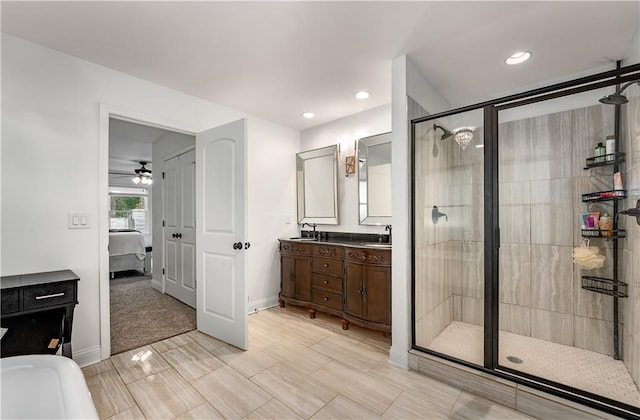 bathroom featuring independent shower and bath and vanity