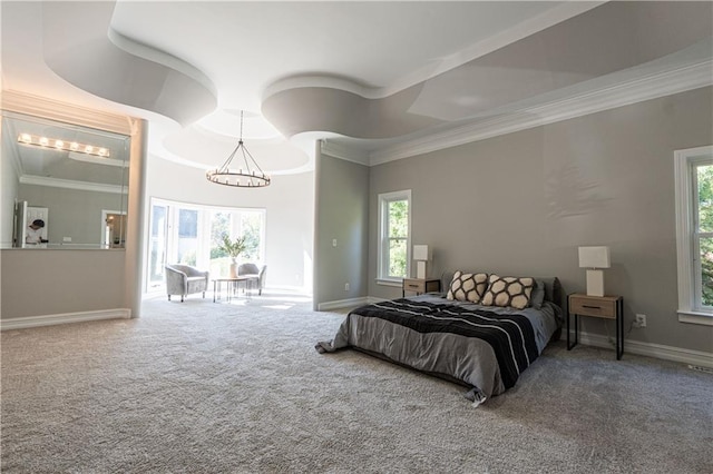 bedroom featuring ornamental molding, multiple windows, and carpet flooring