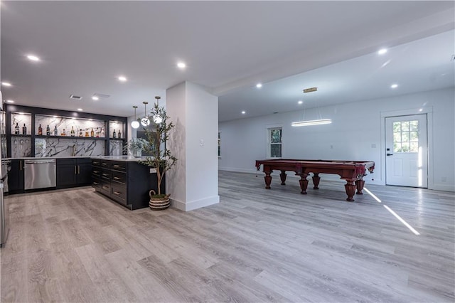 bar featuring stainless steel dishwasher, indoor wet bar, billiards, and light wood-style floors