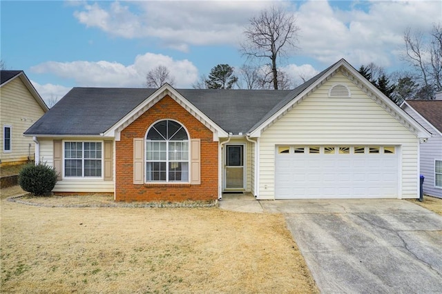 ranch-style home with a garage and a front lawn