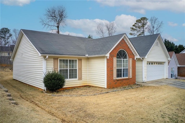 view of front facade with a garage and a front yard