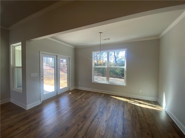 unfurnished dining area featuring crown molding, dark wood-type flooring, and a wealth of natural light