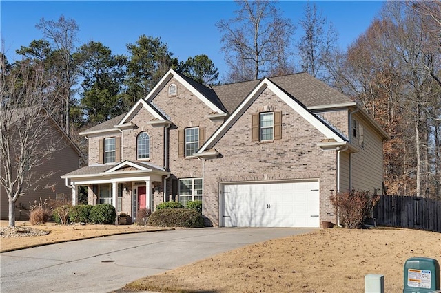 view of front of property with a porch and a garage