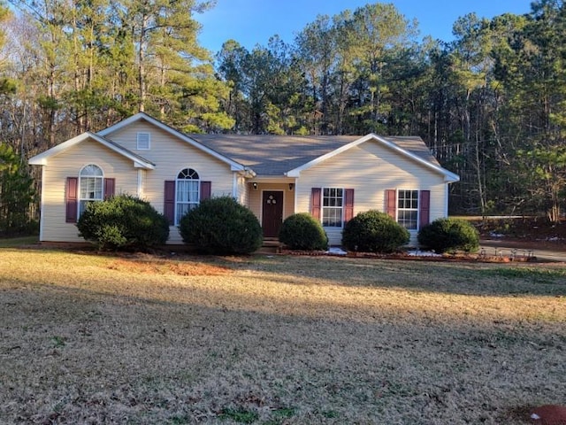 ranch-style house with a front lawn