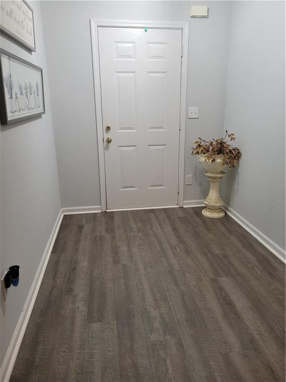 entryway with dark hardwood / wood-style floors