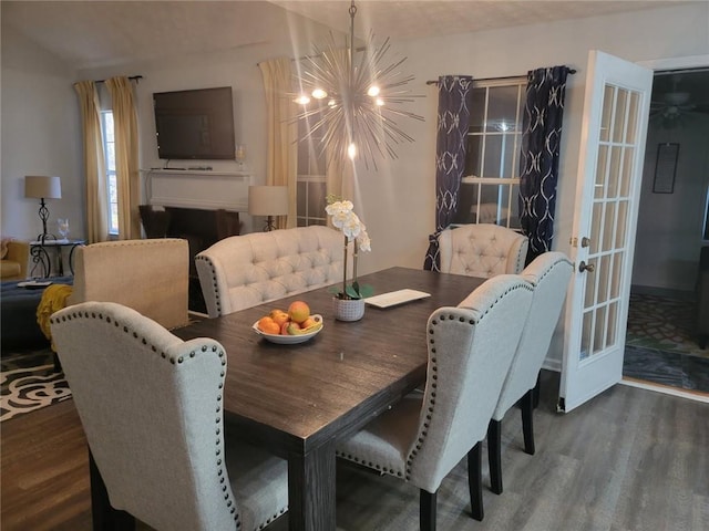 dining room featuring dark hardwood / wood-style flooring and a chandelier