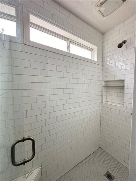 bathroom with an enclosed shower