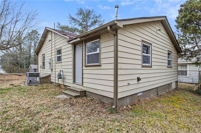 view of side of property featuring cooling unit