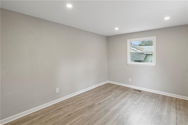 unfurnished bedroom with light hardwood / wood-style floors and a closet