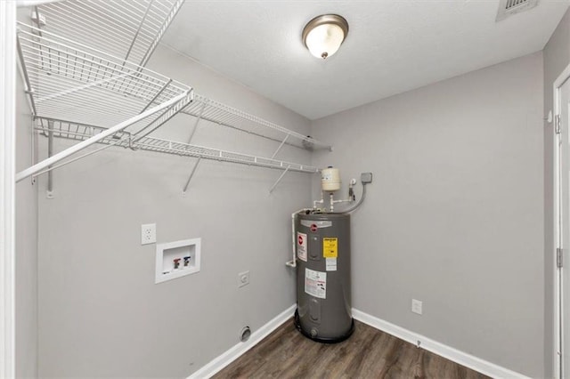 5514 E Stoneway Ct, Villa Rica, GA 30180 - laundry area featuring electric dryer hookup, electric water heater, hookup for a washing machine, wood finished floors, and baseboards