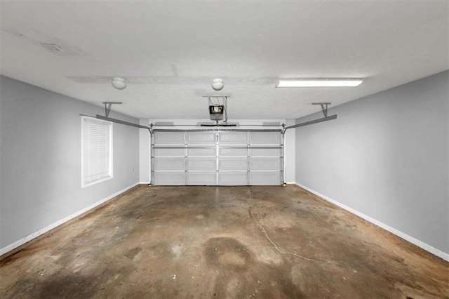 5514 E Stoneway Ct, Villa Rica, GA 30180 - garage featuring baseboards and a garage door opener