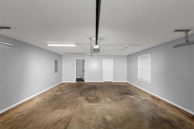 5514 E Stoneway Ct, Villa Rica, GA 30180 - garage featuring baseboards and electric panel