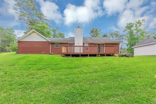 5514 E Stoneway Ct, Villa Rica, GA 30180 - back of house with brick siding, a wooden deck, and a lawn