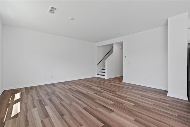 3019 Orwell Dr, Gainesville, GA 30507 - empty room featuring stairway, wood finished floors, and baseboards