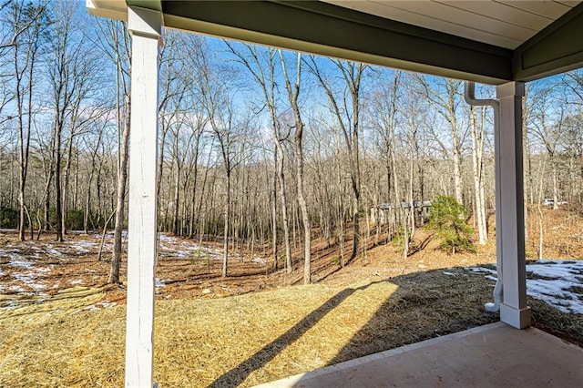 view of yard featuring a view of trees