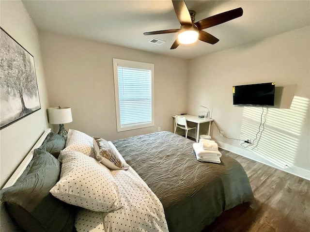 bedroom featuring ceiling fan and wood-type flooring