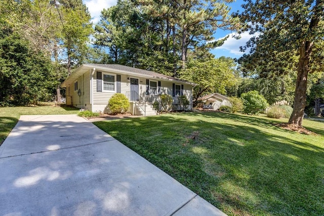 ranch-style home with a front lawn