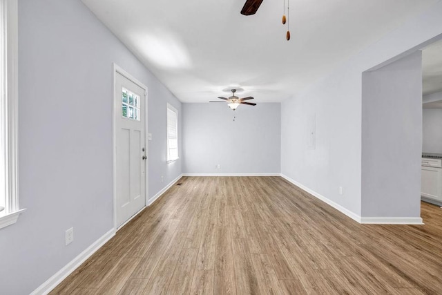 interior space featuring ceiling fan and light wood-type flooring