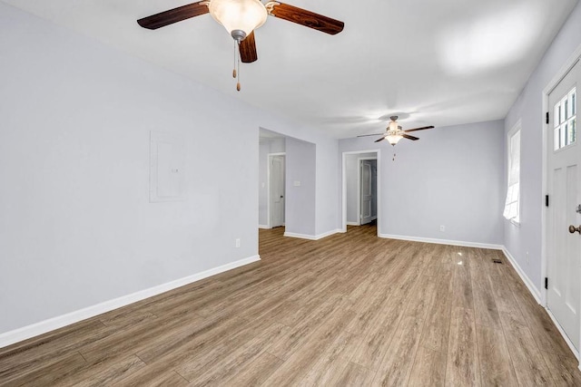 spare room featuring ceiling fan and light hardwood / wood-style floors