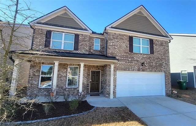 view of front facade featuring covered porch, brick siding, driveway, and an attached garage