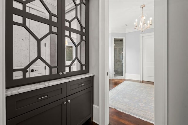 6440 Westchester Pl, Cumming, GA 30040 - bathroom featuring a chandelier, baseboards, wood finished floors, crown molding, and vanity