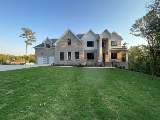 view of front of house with a garage and a front lawn