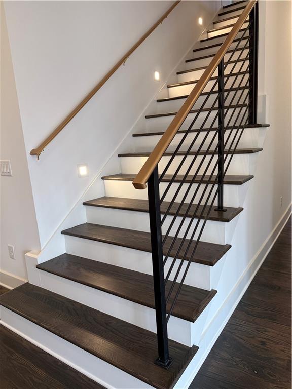 staircase featuring hardwood / wood-style floors