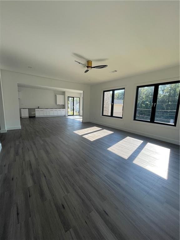 interior space with dark hardwood / wood-style flooring, a wealth of natural light, and french doors