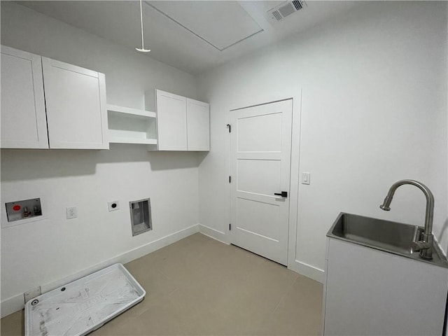 clothes washing area featuring sink, hookup for a washing machine, cabinets, and hookup for an electric dryer