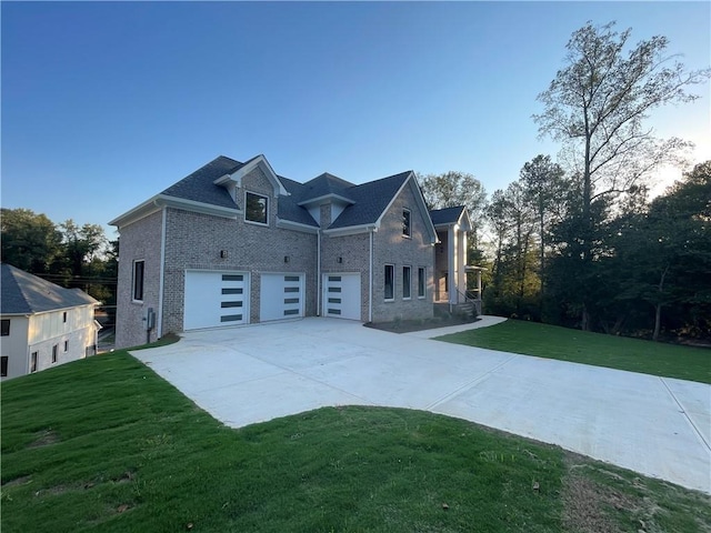 view of front of house with a garage and a front yard