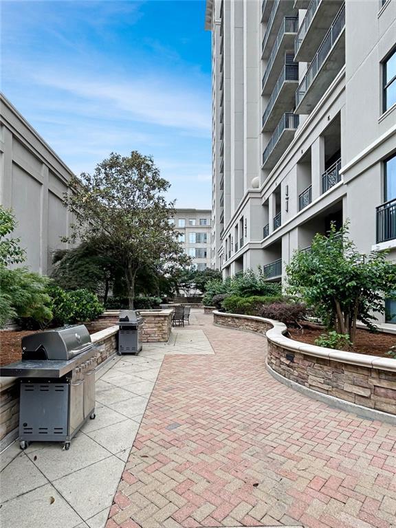 3040 Peachtree Rd NW Unit 1501, Atlanta, GA 30305 - surrounding community with a patio and outdoor dining space