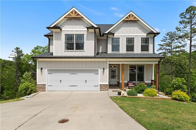 35 Bridgestone Way SE, Cartersville, GA 30120 - craftsman house featuring a porch, an attached garage, driveway, a shingled roof, and stone siding