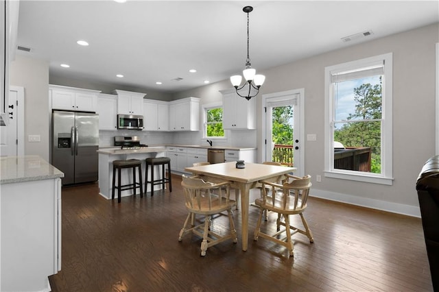 35 Bridgestone Way SE, Cartersville, GA 30120 - dining area with dark wood-style floors, recessed lighting, a chandelier, and baseboards