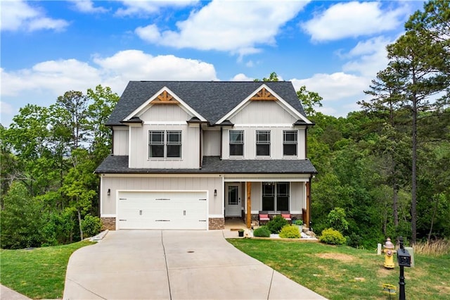 35 Bridgestone Way SE, Cartersville, GA 30120 - craftsman house with covered porch, driveway, a shingled roof, and a front lawn