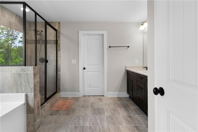35 Bridgestone Way SE, Cartersville, GA 30120 - bathroom with a shower stall, a bath, vanity, and baseboards