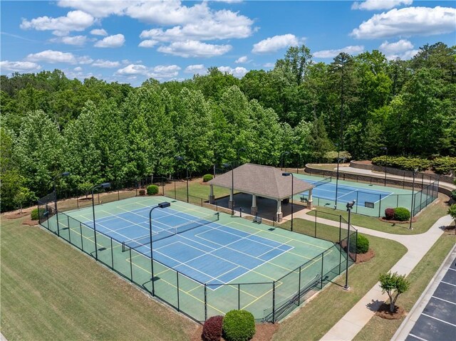 35 Bridgestone Way SE, Cartersville, GA 30120 - view of tennis court with a wooded view