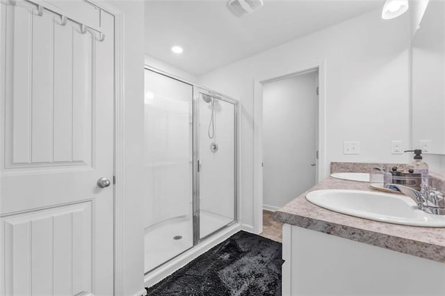 5668 Union Pointe Dr, Union City, GA 30291 - full bathroom with a shower stall, double vanity, recessed lighting, and baseboards